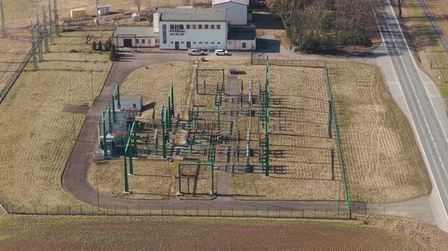 Aerial view of electrical substation with transformers in Svitavy.
Steel structures and power grid infrastructure from drone.