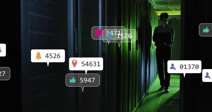 Animaton of social media icons against asian male engineer using laptop at computer server room