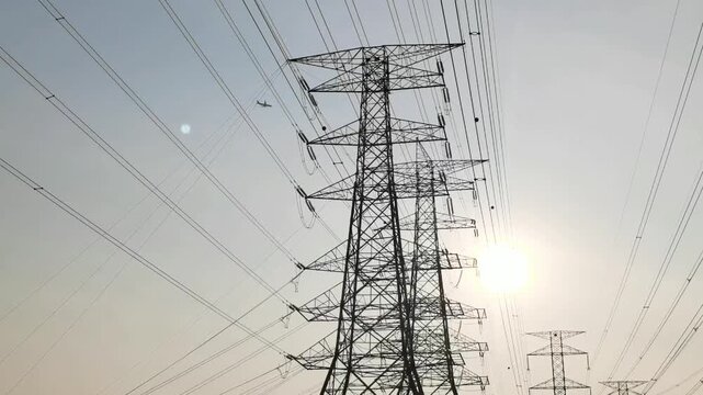 Rows of dozens of electricity towers