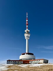 Obraz premium Praded television tower and mountain hotel on the summit in winter, Jeseniki, Czech Republic