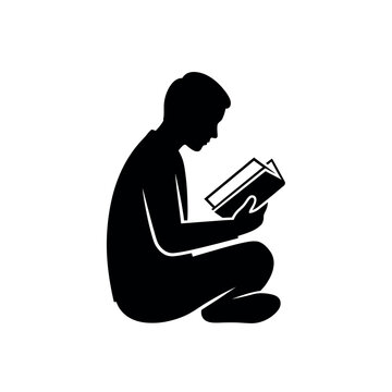 Silhouette of Person Sitting and Reading a Book