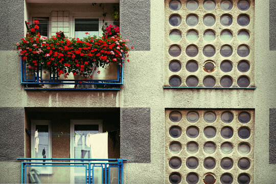 Residential Building Facade with Modernist Balconies and Glass Block Wall Pattern