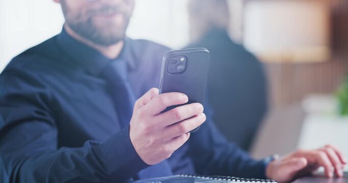 Hands, phone and businessman with laptop in office for record keeping, finance app and auditing. Staff, accountant and typing on tech for financial reporting, budget review or track income with flare
