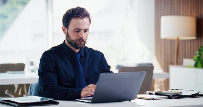 Business, man and typing on laptop at desk for record keeping, internal auditing and payroll. Serious, accountant and tech in office for tax preparation, compliance report and client account review