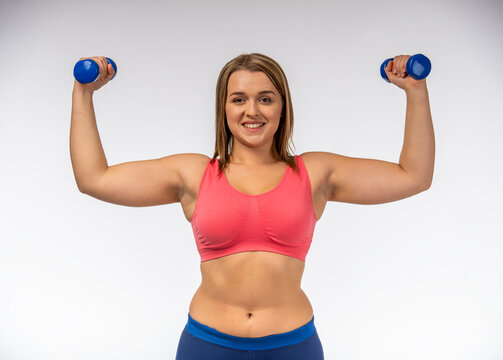 Woman Lifting Dumbbells Strong.