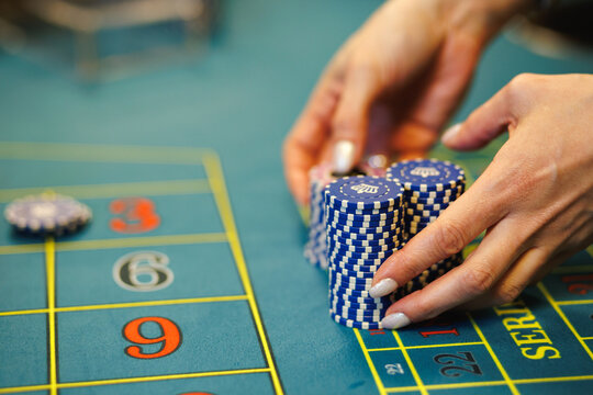 Croupier Managing Bets on Roulette Table Close-Up
