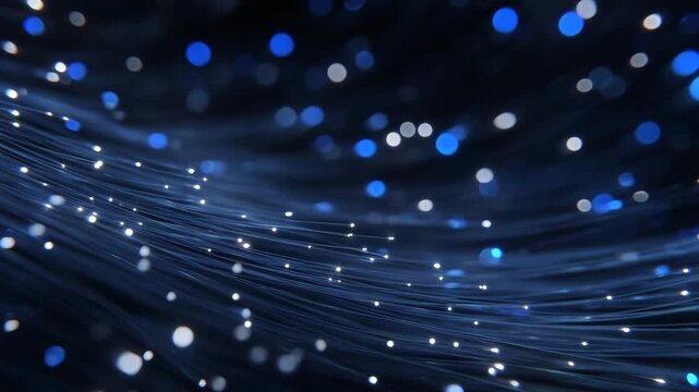 74Cinematic macro close-up of fiber optic strands glowing intensely, light pulses traveling through the cable, digital nodes and network patterns softly blurred in the background, ad