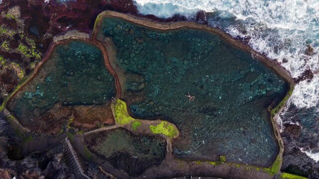 Aerial Panoramic View Woman Swimming Volcanic Rock Pool Sunrise El Hierro Canary Islands Spain Natural Pool Solitude