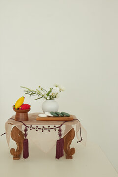 Complete arrangement of Korean heritage ornaments on an octagonal tray with white wall copy space