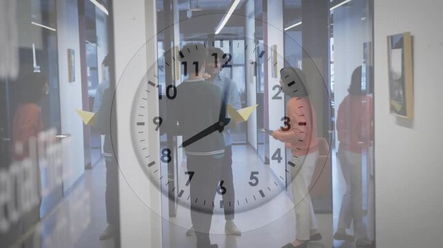 Animation of clock with fast moving hands over diverse colleagues talking at causal office