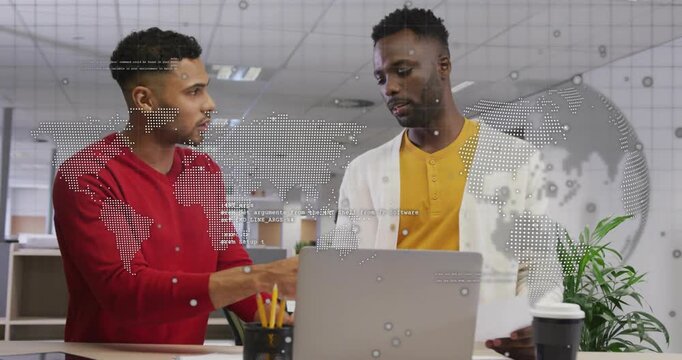 Two men reaching pencil, pointing laptop, reviewing paper, tapping device, map overlay aiding biz
