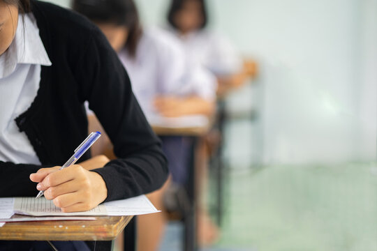 Close-up of Student Hand Filling Out Bubble Answer Sheet During Standardized Test