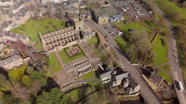 Drone view of Jedburgh, Scottish Borders buildings and hills on a sunny day