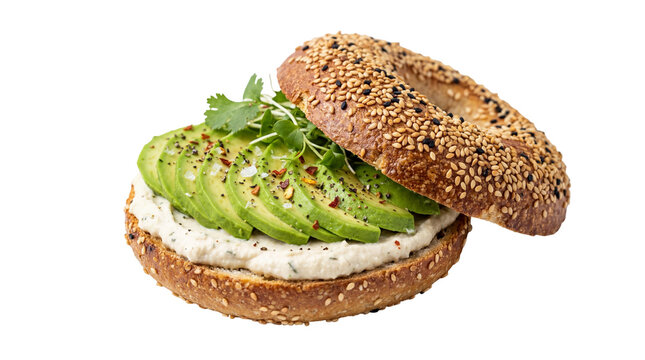 Toasted sesame bagel generously spread with creamy white hummus and layered with fresh green avocado slices, isolated on transparent background for healthy breakfast menus