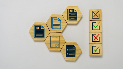 Obraz premium Checklist and document verification concept with wooden cube on white background.