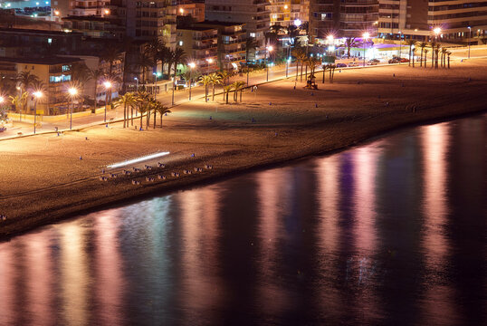 Night view of the illuminated Playa de Levante beach and promenade with palm trees and street lights, Benidorm, Costa Blanca, Alicante, Spain, Europe