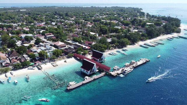 Aerial drone hovering above the right coastal side of Gili Trawangan harbor, Indonesia.