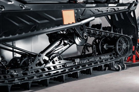 Snowmobile Track System and Suspension Wheels Close Up Winter Vehicle Mechanical Engineering