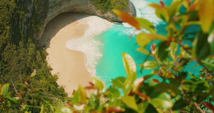 Turquoise water meets white sand at Kelingking Beach on Nusa Penida Bali Island