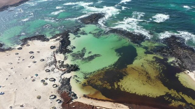 Aerial View of Natural Pools and Stone Shelters at Playa de los Charcos Fuerteventura