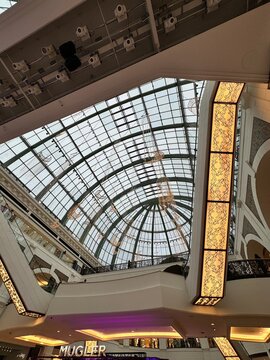 Interior view of the Mall of the Emirates with a glass dome and Ramadan decorations, April 2024