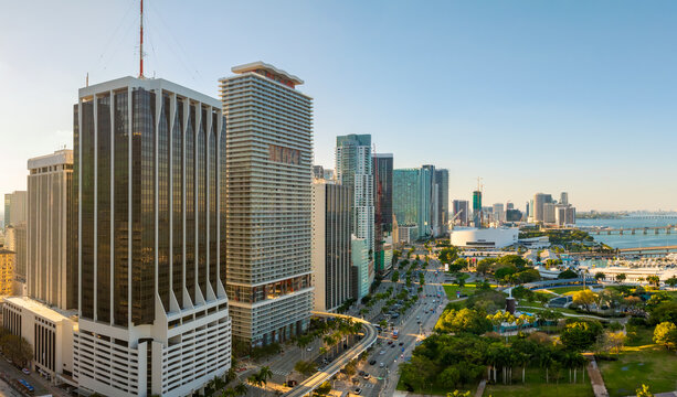 Urban cityscape of Miami Brickell downtown district in Florida, USA at sunset. Skyline with waterfront skyscraper buildings in modern American city