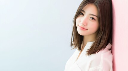 Fototapeta premium パステルカラーの背景と日本人女性