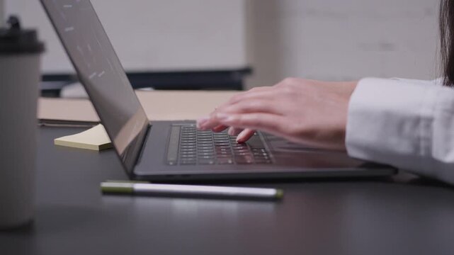 Businessman working on laptop computer in office