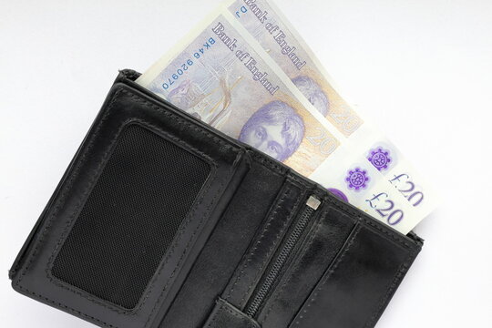British punds with black wallet. Money bills. Travel concept photo.