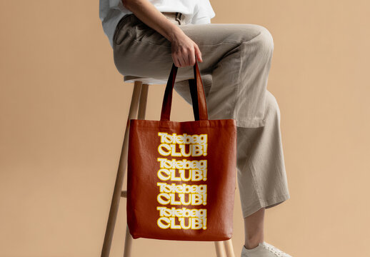 Tote Bag Mockup With Model Sitting On Stool Studio Scene