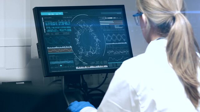 Doctor looking at x-ray on digital screen in modern medical office