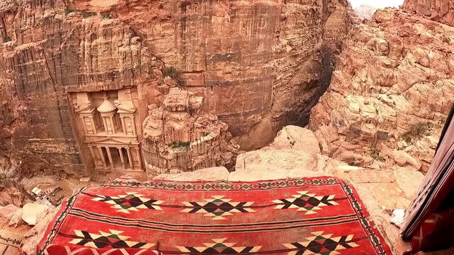 The Treasury in Petra, Jordan archeological site seen from the above tea house in slow motion.