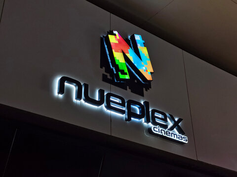 Karachi Pakistan - March 26, 2026:  The glowing logo of Nueplex cinema on the wall of multiplex Karachi 
