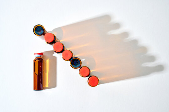 Medicine vials in a row for healthcare treatment progress