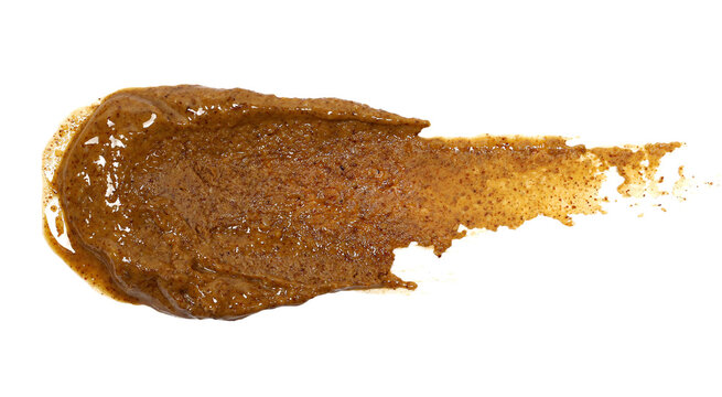 Almond butter spread with coconut oil isolated on white background, top view, clipping