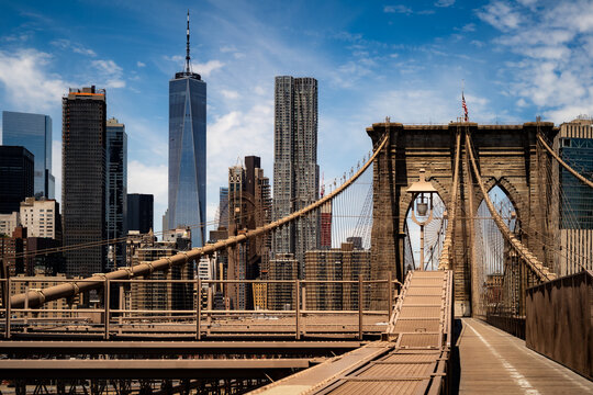 Walking across the Brooklyn Bridge in New York City.