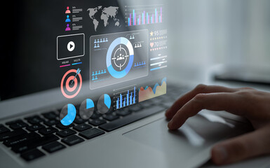 A modern laptop showcases a dashboard of digital data analytics, featuring interactive graphs and...