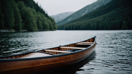 Fototapeta premium A wooden canoe resting on the calm surface of a lake, perfect for a peaceful afternoon