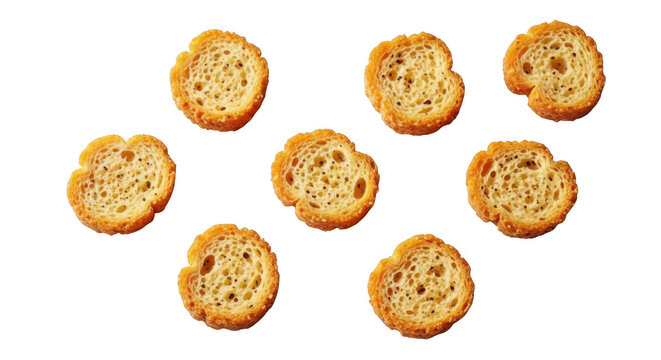 Seven golden brown croutons are arranged artfully against a black backdrop on transparent background high quality