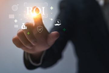 Naklejka premium ROI (Return on Investment), financial trading, business concepts, progress in business performance, evaluating the value and profitability of a business; business people point to ROI.