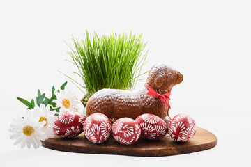 Easter lamb cake with red eggs and green grass © vetre