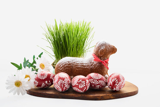Easter lamb cake with red eggs and green grass