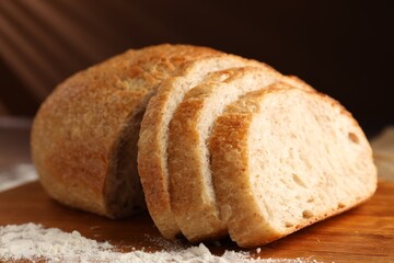 Naklejka premium Pieces of fresh bread on table, closeup