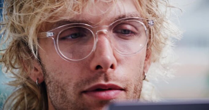 Creative, vision and businessman with laptop in office, proofreading and editing article on website. Magazine editor, glasses and person with tech for media publication, online or review in newsroom