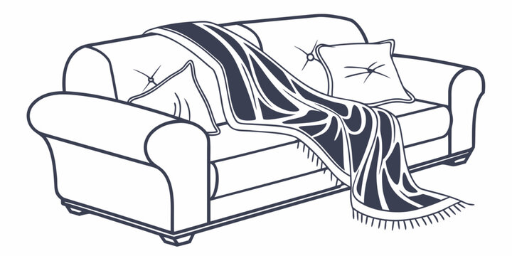 A cozy couch adorned with a striped blanket and decorative pillows.