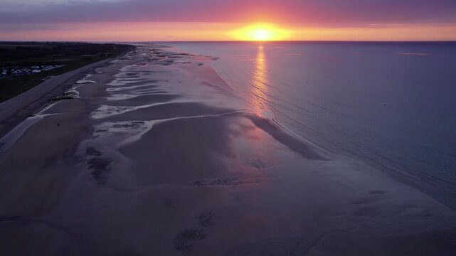 Aerial view of the beach at sunset over Juno Beach