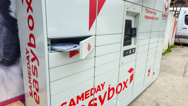 Varna. Bulgaria. 27.03.2026 modern parcel locker system installed outdoors with open compartment and package inside convenient solution for shipping and self pickup services
