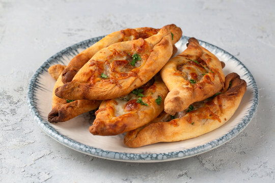 Traditional Turkish Mini Pide - Small Flatbreads with Minced Meat and Cheese