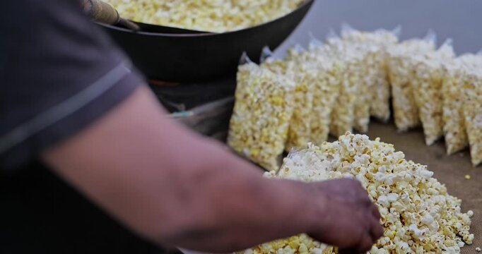 Street vendors selling pani puri, popcorn, and boiled berries in a lively market, capturing vibrant street food culture and everyday local life