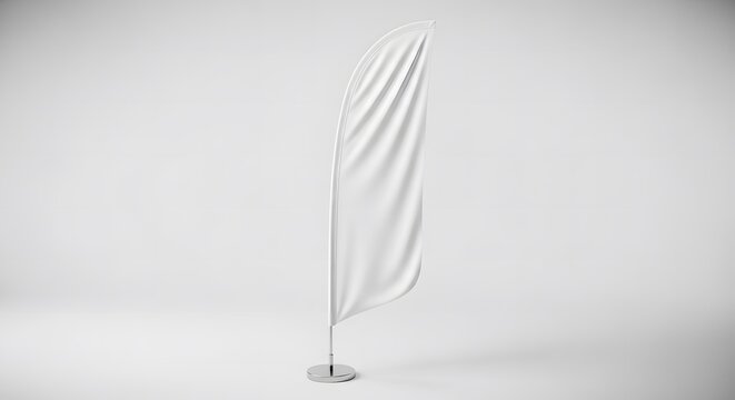 Blank white feather flag banner on a stand in a studio setting